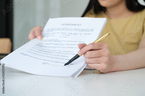 Business woman and partner sign a contract investment professional document agreement in meeting room.