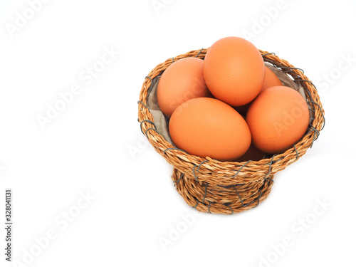 Wallpaper Mural A group of eggs stacked in wicker baskets isolated on a white background. The concept of a high protein and vitamin diet can be eaten every day. Torontodigital.ca