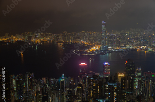Cityscape famous Hong Kong buildings towers by night harbor