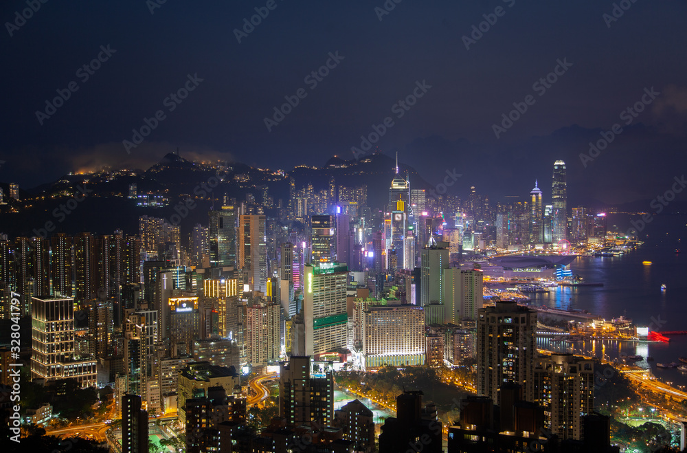 Cityscape various Hong Kong motorboats sail on wide river