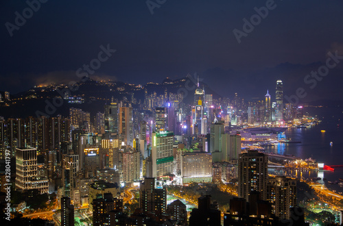 Cityscape various Hong Kong motorboats sail on wide river © Yan