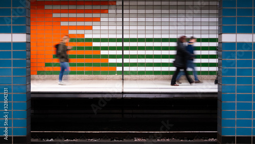 Blurred moving people on the subway platform in Hamburg.