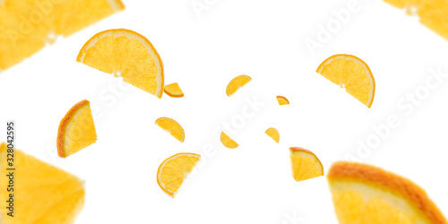 Background orange lemon slices. Citrus fruit tangerine falling on white. Selective focus.
