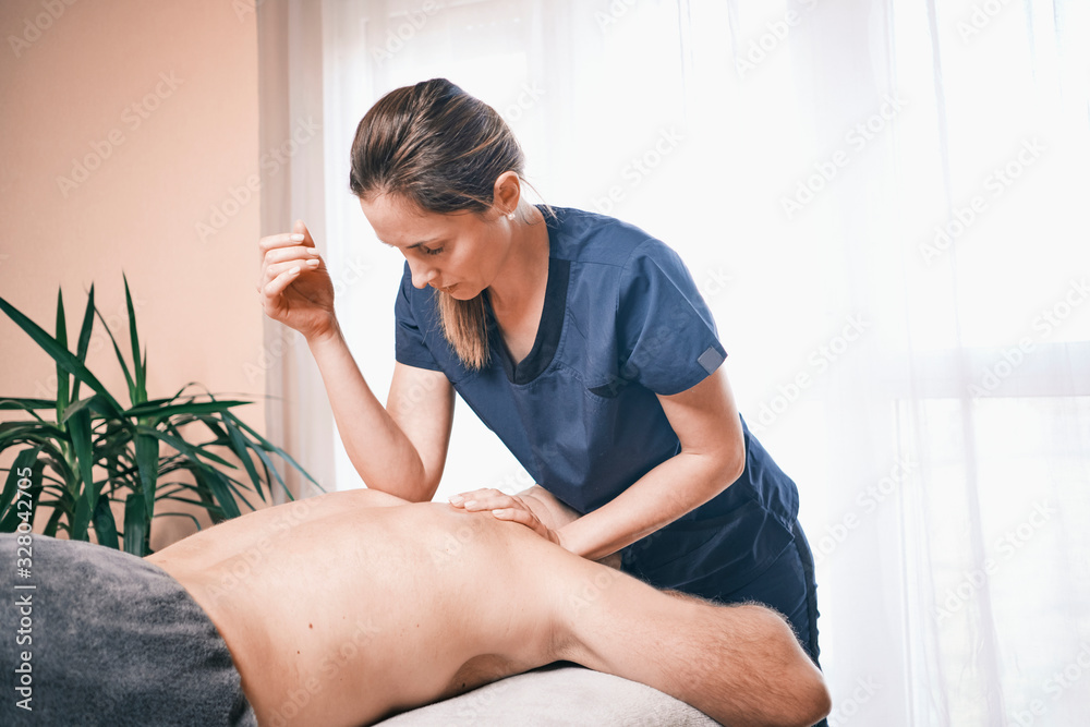 massage therapists in the massage room massage the girl on the massage table massage therapists in the massage room massage the girl on the massage table