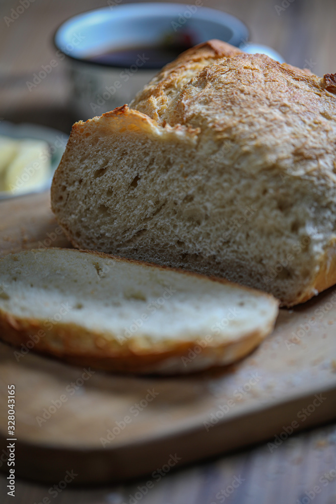Sliced boule bread with butter Sliced boule bread with butter