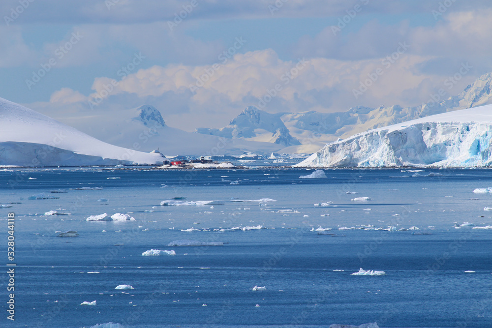 Frozen coasts, icebergs and mountains of the Antarctic Peninsula. The Chilean González Videla Antarctic Base in  Paradise Bay on the Danco Coast, Antarctica