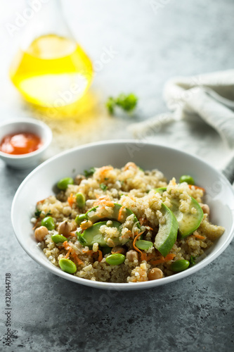 Healthy quinoa bowl with soy beans and avocado