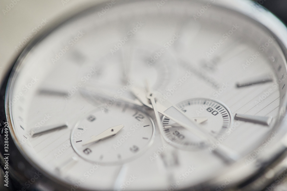 Men's classic watch (clock) on the table.