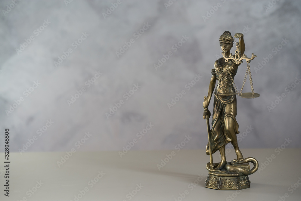 Themis. Law and Jusitce concept photo, grey stone background