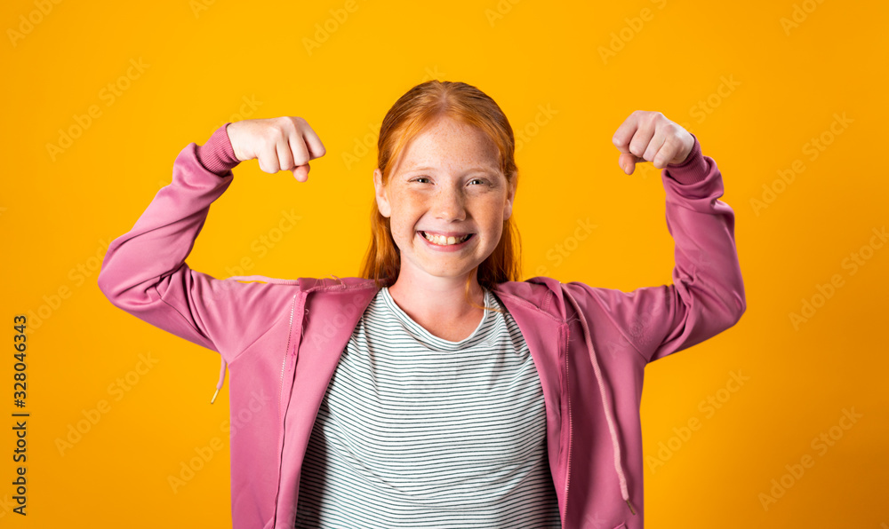 Red Haired Girl Flexing Her Biceps and Smiling Camera Red Haired Girl Flexing Her Biceps and Smiling Camera