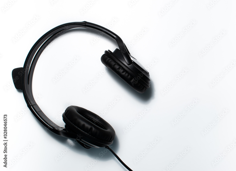 Headphones on a background. Flay lay, seen from above of a pair of headsets. Headphones on a background. Flay lay, seen from above of a pair of headsets.