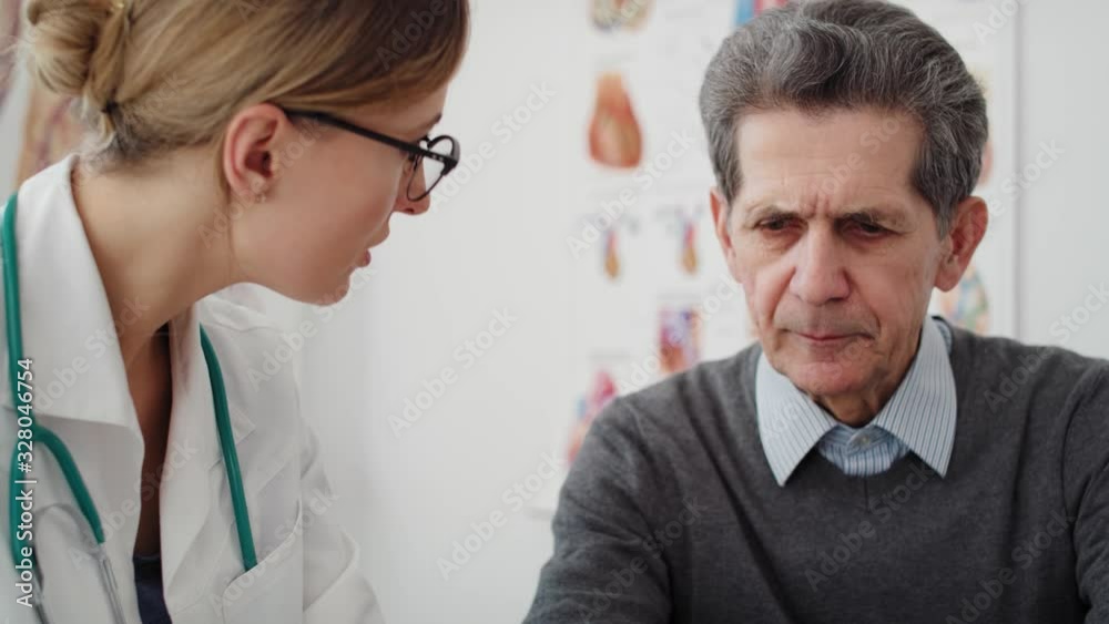 Handheld view of doctor telling patient the diagnosis. Shot with RED helium camera in 8K Handheld view of doctor telling patient the diagnosis. Shot with RED helium camera in 8K