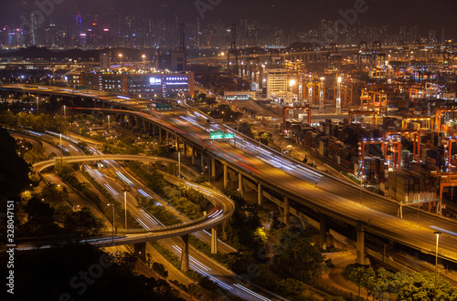 Container port Hong Kong overpass road with orange illumination