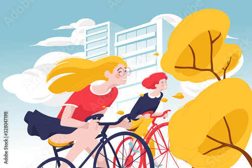 Young happy women riding bicycle in city