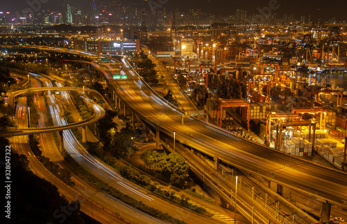 Container port Hong Kong overpass road near modern harbour cranes