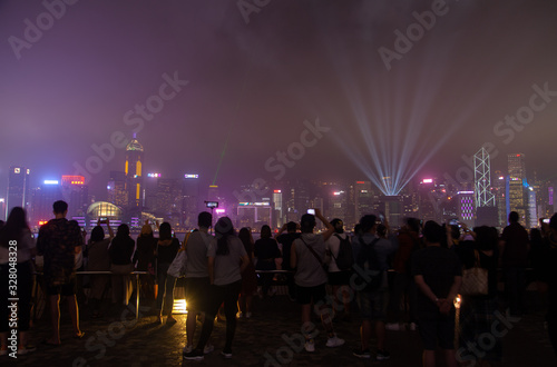 crowds of tourists visit Hong Kong embankment