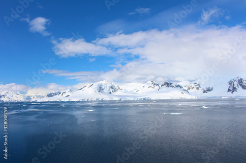 Frozen coasts, icebergs and mountains of the Antarctic Peninsula. The mountains at Paradise Bay on the Danco Coast, Antarctica