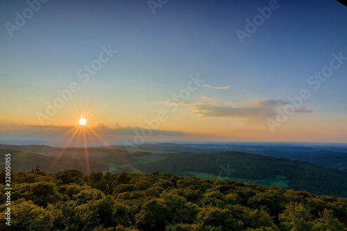 beautiful sunset in the middle of nature, great view with beautiful sunset in deutschalnd Hessen Taunus... sunset in the mountains  photo