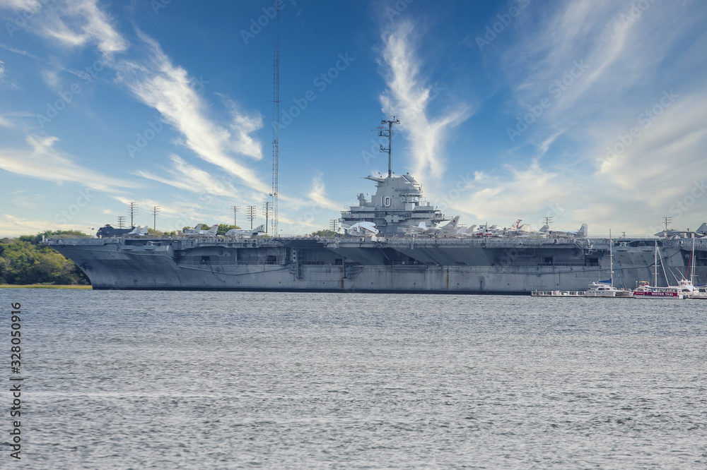 An American aircraft carrier docked in bay near Charleston, South Carolina An American aircraft carrier docked in bay near Charleston, South Carolina