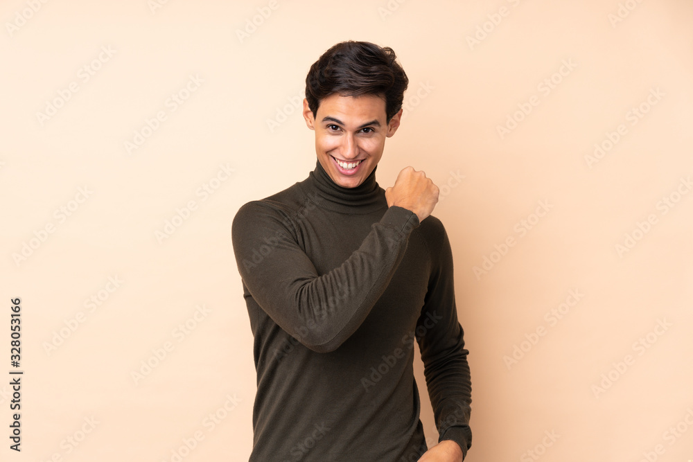 Man over isolated background celebrating a victory Man over isolated background celebrating a victory