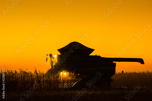 Chapadão do Sul, Mato Grosso do Sul, Brazil, February 27, 2019: Agriculture - formation of agricultural machines, aerial image of the corn crop with several machines, high productivity in the field - 