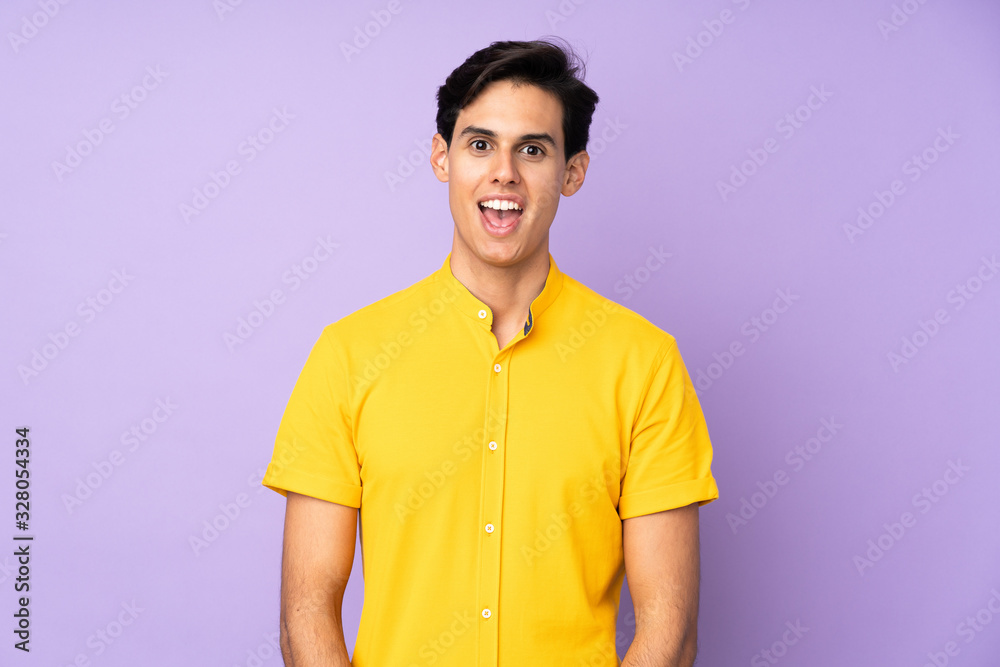 Man over isolated purple background with surprise facial expression Man over isolated purple background with surprise facial expression