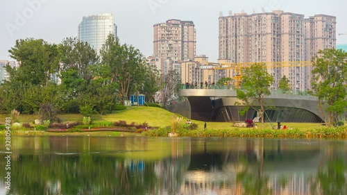 sunset time chengdu city center park lake apartment complex timelapse panorama 4k china photo