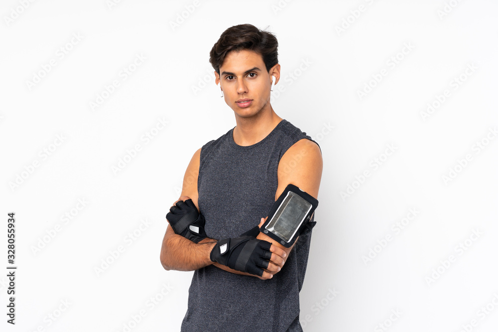 Sport man over isolated white background with arms crossed Sport man over isolated white background with arms crossed