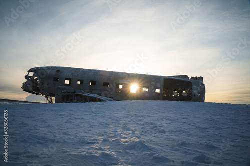 Wreck of Old Plane on Icelandic Black Sand Beach. Amazing Landscape Background.