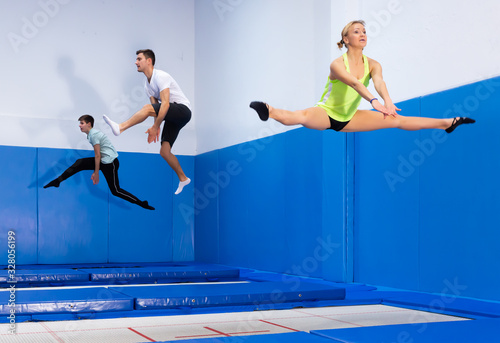People jumping in trampoline center