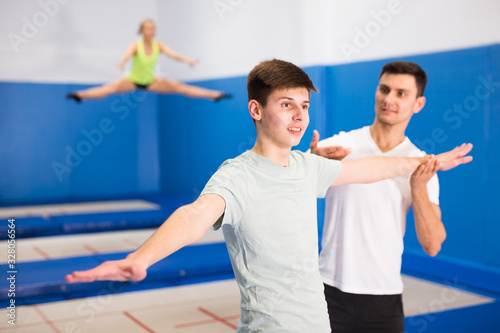 People preparing to trampoline training