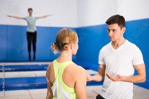People warming up before trampoline training