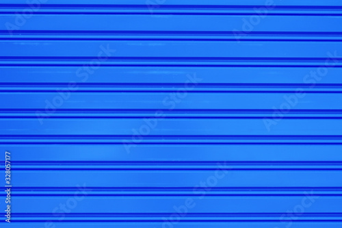 Horizontal line texture metal sheet blue colour. Graphic resource. Copy space for text.