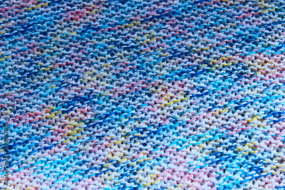 Cropped shot of colorful knitted sweater texture. Abstract texture background. 
