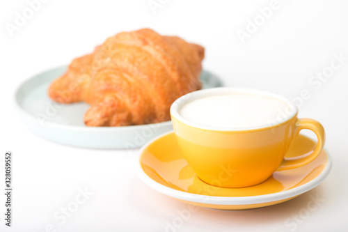 yellow cup on a white  background