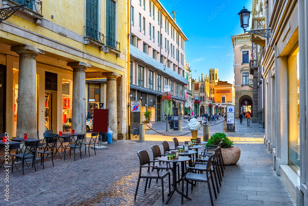 Old street with tables of pizzeria in Padua (Padova), Veneto, Italy