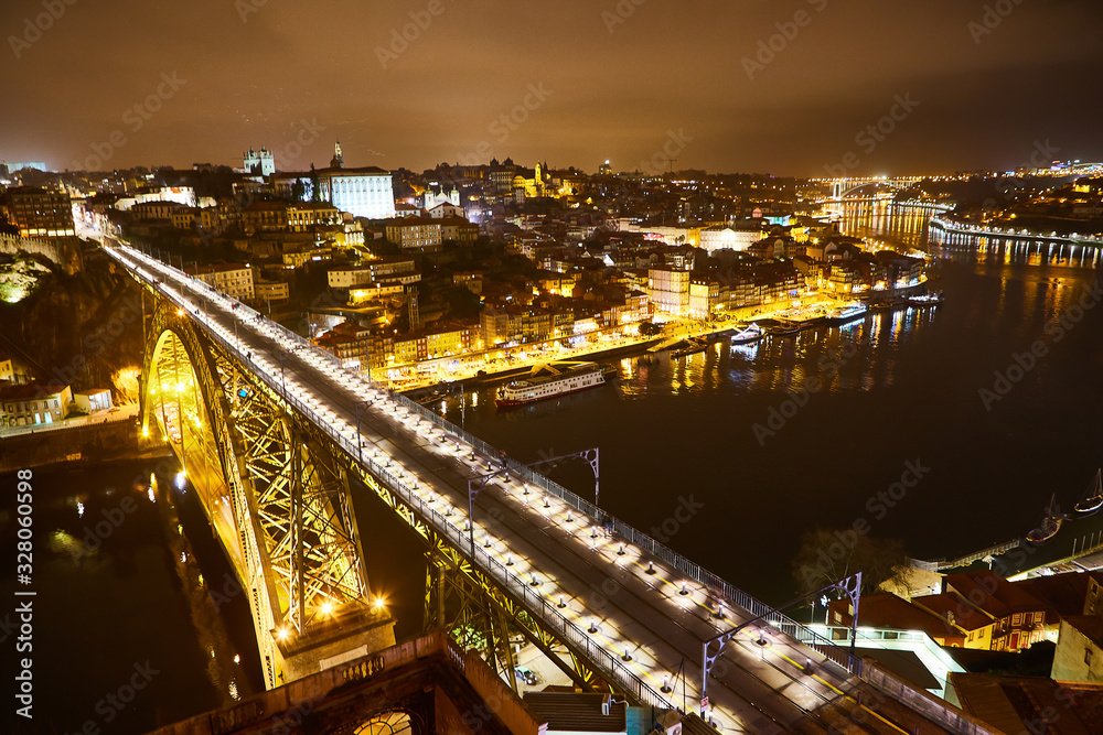Fototapeta premium Night View of cityscape of Porto, Portugal over Dom Luis I Bridge and Douro River