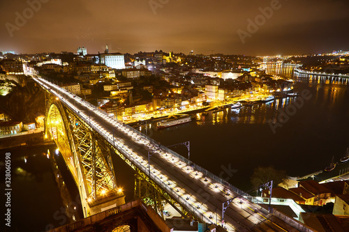 Fototapeta Naklejka Na Ścianę i Meble -  Night View of cityscape of Porto, Portugal over Dom Luis I Bridge and Douro River