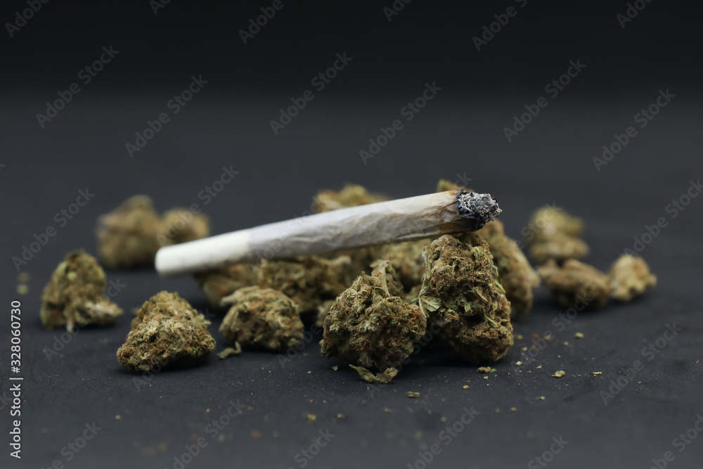 custom made wallpaper toronto digitalCannabis and joint isolated on a black background.