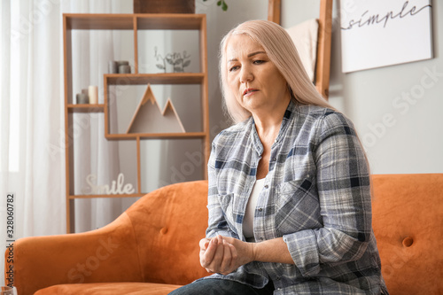 Senior woman suffering from...