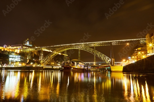 Night View of cityscape of Porto, Portugal over Dom Luis I Bridge and Douro River