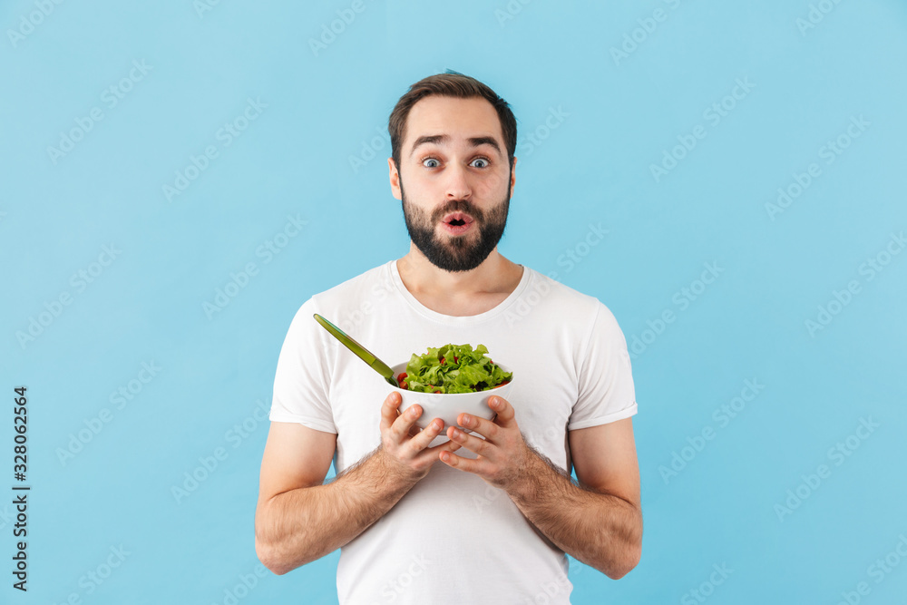 Handsome young bearded man wearing t-shirt standing Handsome young bearded man wearing t-shirt standing