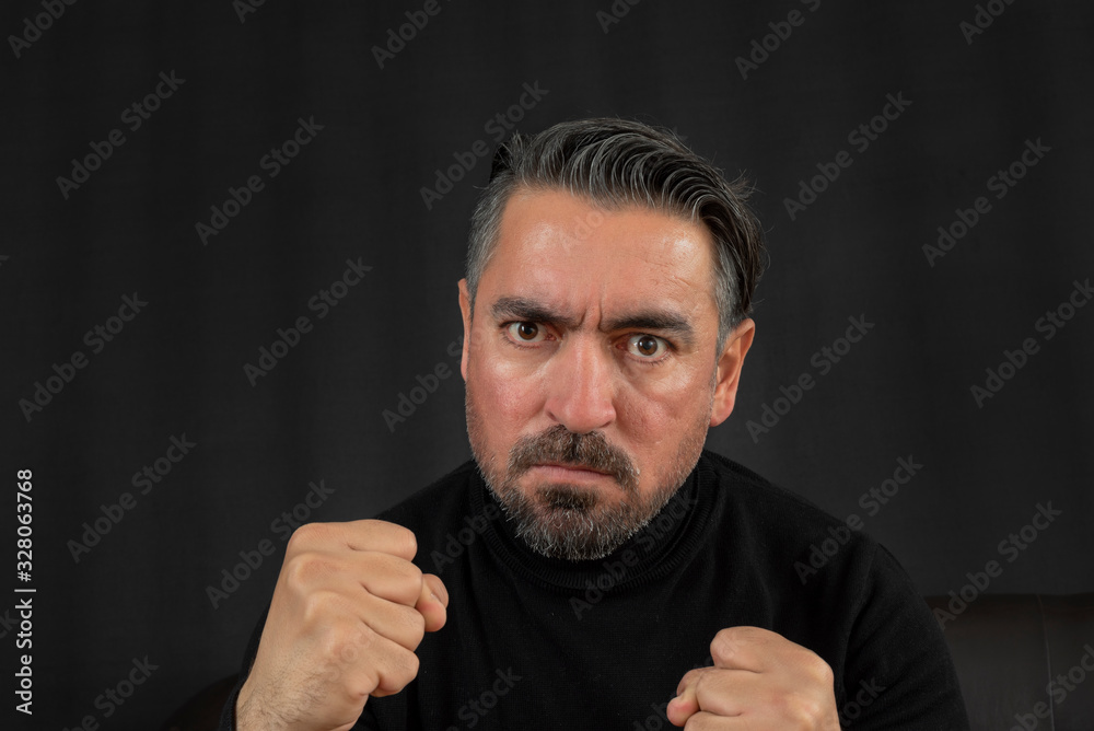 Portrait of angry man on black background Portrait of angry man on black background