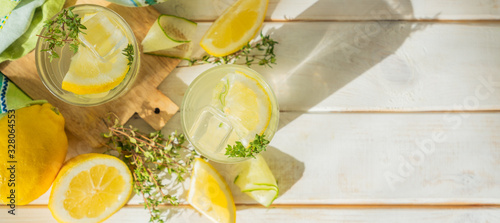 Detox drinks infused water and ingredients on wood background, copy space