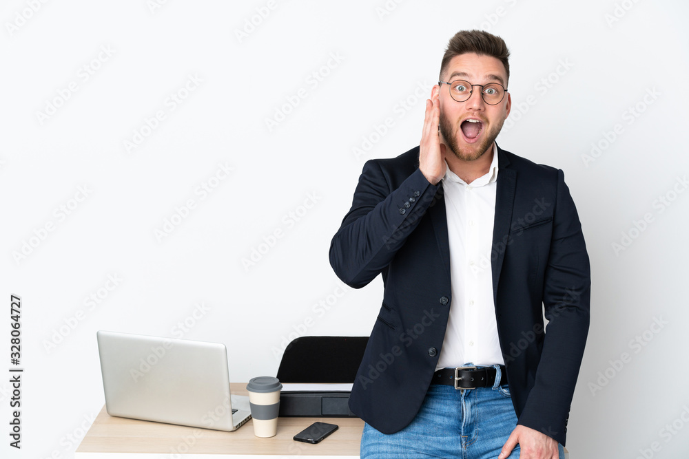 Russian man in a office isolated on white background with surprise and shocked facial expression Russian man in a office isolated on white background with surprise and shocked facial expression