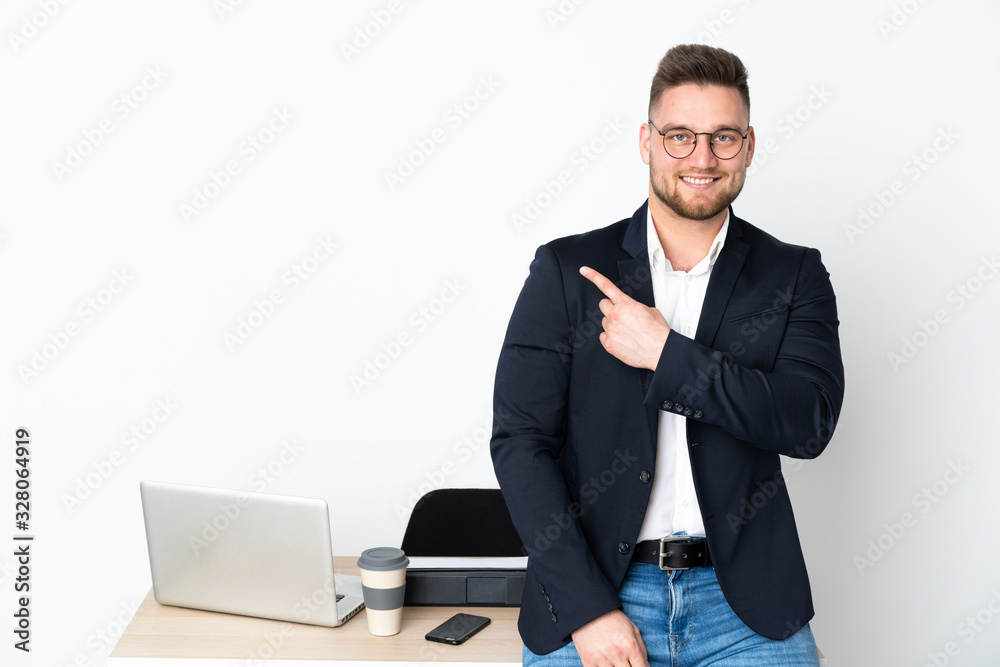 Russian man in a office isolated on white background pointing to the side to present a product Russian man in a office isolated on white background pointing to the side to present a product