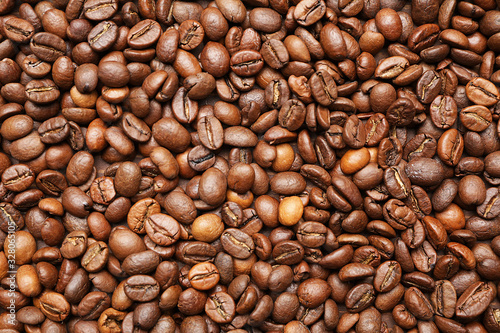 Many coffee beans as background