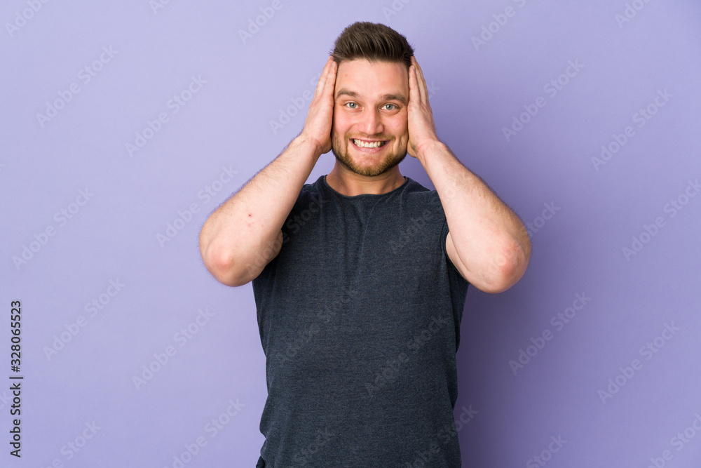 Russian handsome man over isolated background doing nervous gesture Russian handsome man over isolated background doing nervous gesture