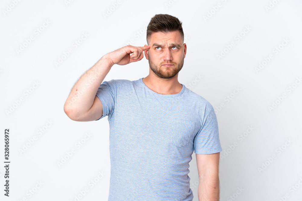 Russian handsome man over isolated background making the gesture of madness putting finger on the head Russian handsome man over isolated background making the gesture of madness putting finger on the head