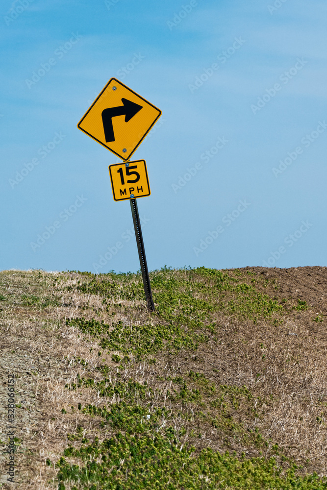 Road sign warning at the top of a hill